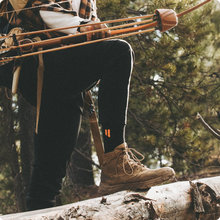 Hunter with a bow wearing Hollow Hunt Socks