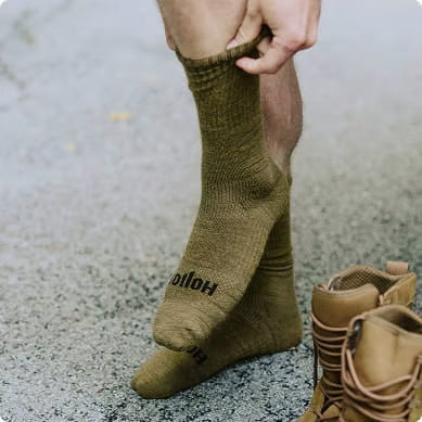 Tactical Socks being rolled up on a foot.