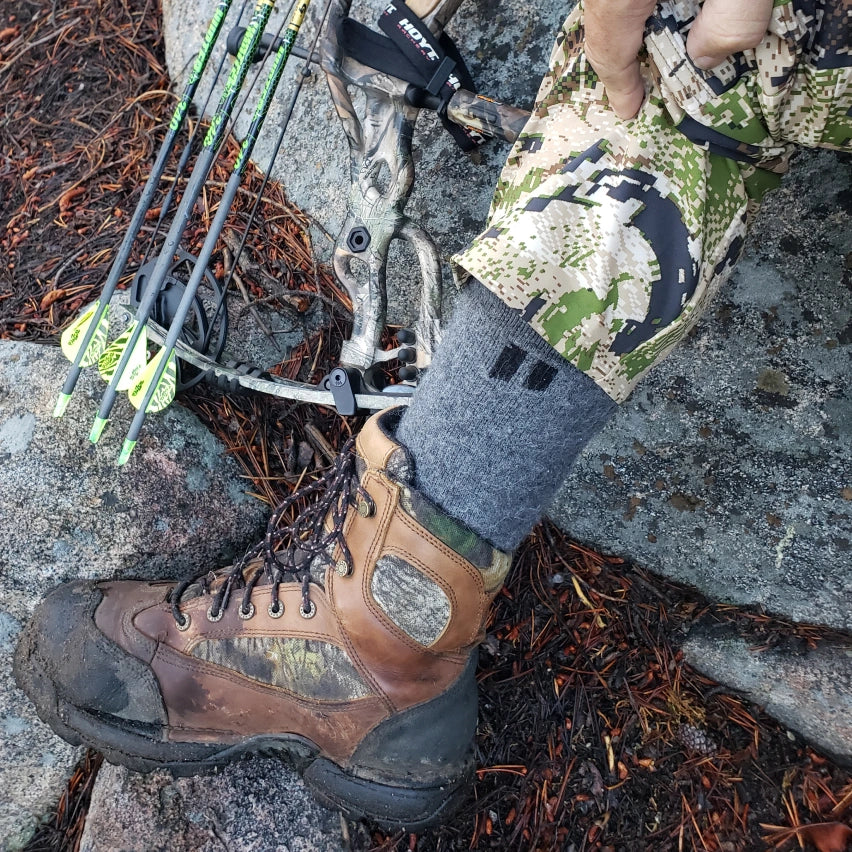 Alpaca socks in hiking boots on rocky terrain