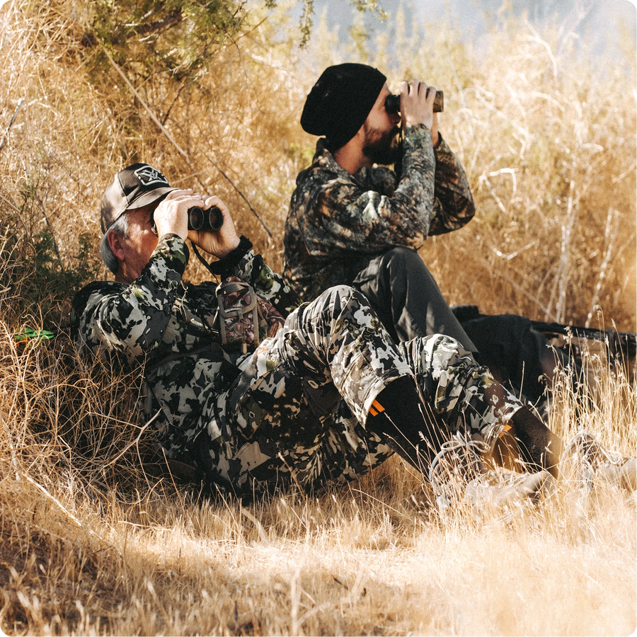 Two guys hunting while wearing Hollow Hunt socks.